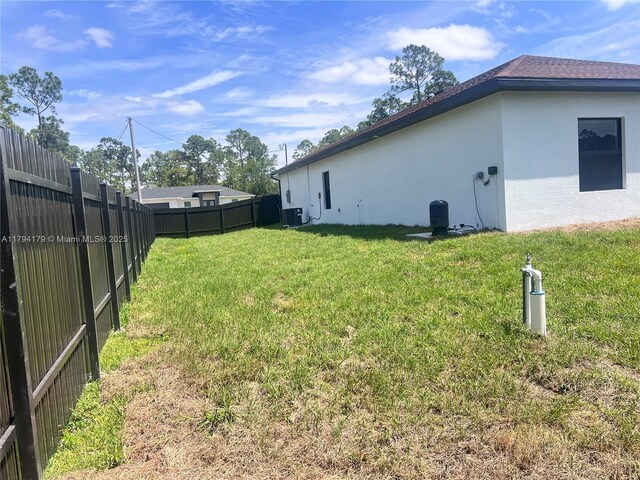 920 E Barton St, Lehigh Acres, FL 33974 - view of yard with central AC unit