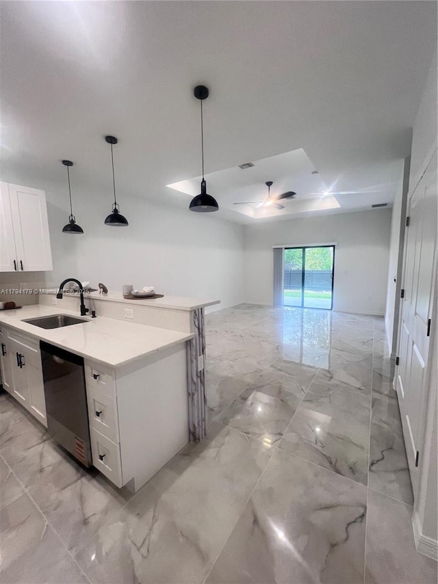920 E Barton St, Lehigh Acres, FL 33974 - kitchen with a sink, dishwasher, light marble finish floors, white cabinets, and light countertops