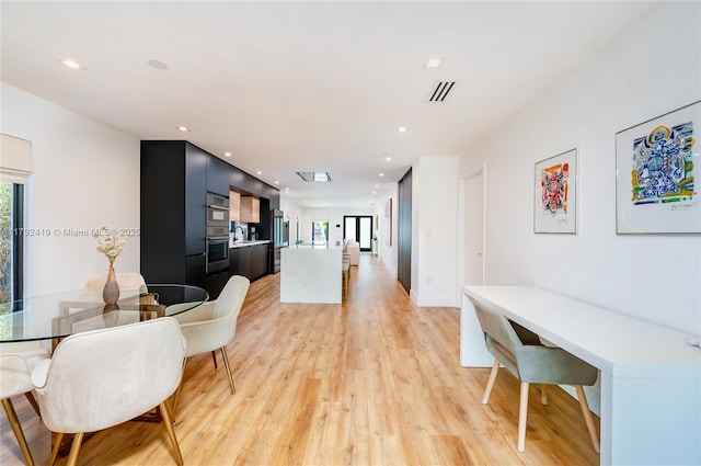 dining area featuring light wood-style floors, recessed lighting, and visible vents