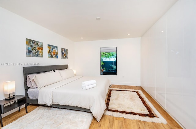 bedroom with light wood-style floors