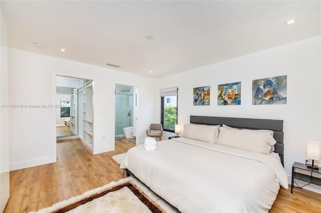 bedroom with visible vents, baseboards, recessed lighting, connected bathroom, and light wood finished floors