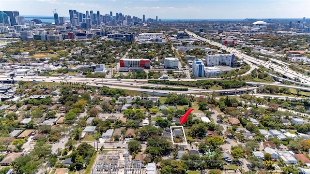 birds eye view of property with a view of city