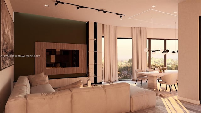 living area with light wood-style floors and baseboards