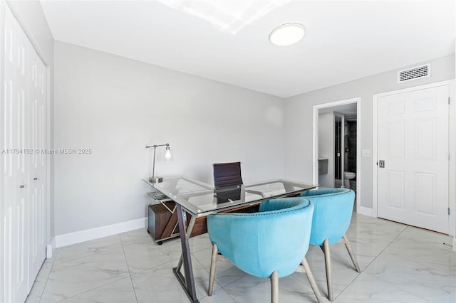 office area featuring baseboards, visible vents, and marble finish floor
