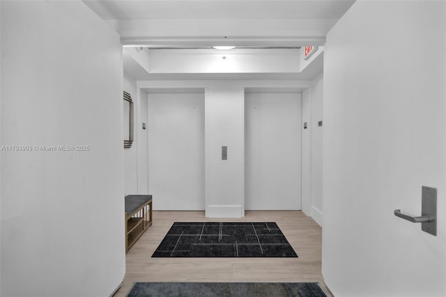 333 Las Olas Way Unit 2209, Fort Lauderdale, FL 33301 - mudroom featuring wood finished floors and a raised ceiling