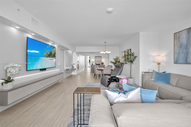 333 Las Olas Way Unit 2209, Fort Lauderdale, FL 33301 - living area featuring light wood-style flooring, a chandelier, baseboards, and recessed lighting