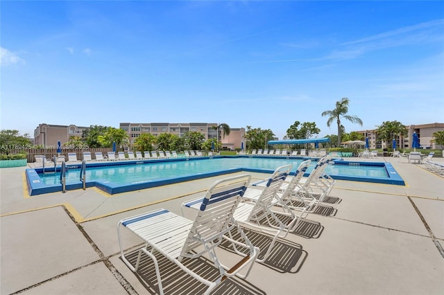 community pool featuring a patio area
