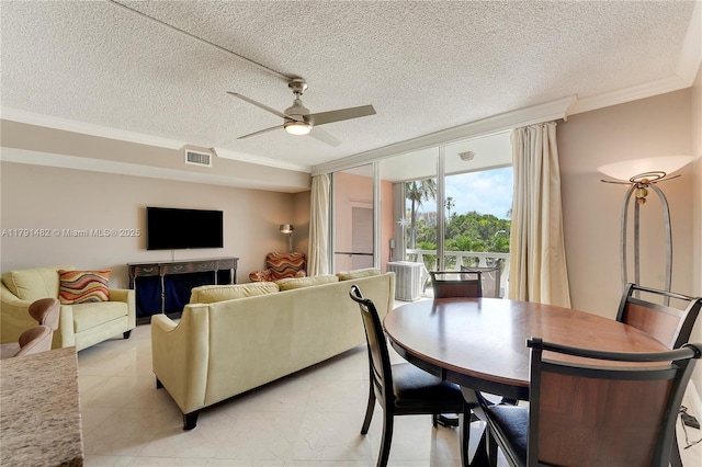 interior space featuring visible vents, a textured ceiling, crown molding, and ceiling fan