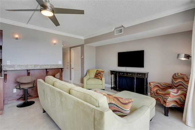 living area featuring crown molding, a textured ceiling, ceiling fan, and visible vents