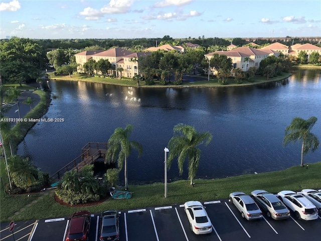 birds eye view of property featuring a water view and a residential view