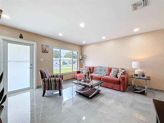 living room with visible vents, recessed lighting, baseboards, and marble finish floor