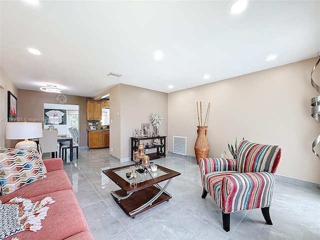 living room featuring visible vents, recessed lighting, and baseboards