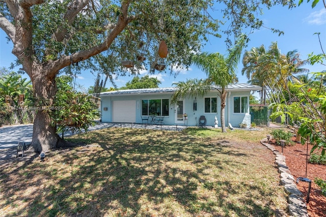 1531 NE 32nd St, Pompano Beach, FL 33064 - ranch-style home featuring a garage, fence, stucco siding, and a front yard