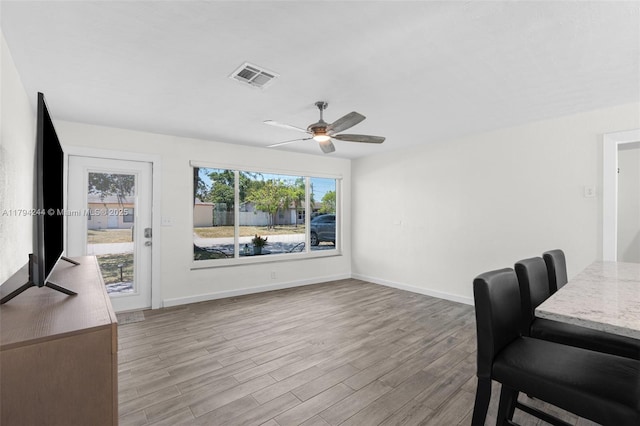 1531 NE 32nd St, Pompano Beach, FL 33064 - dining space with baseboards, ceiling fan, visible vents, and wood finished floors