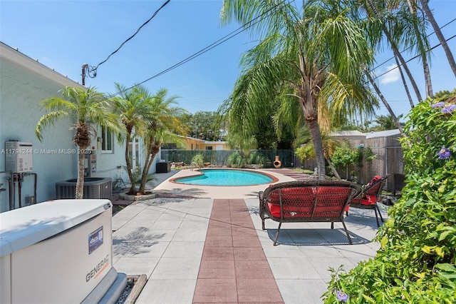 1531 NE 32nd St, Pompano Beach, FL 33064 - view of swimming pool featuring cooling unit, a fenced backyard, a patio area, and a fenced in pool