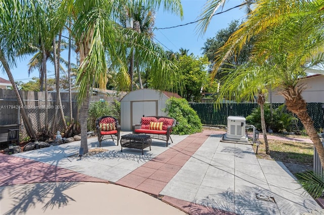1531 NE 32nd St, Pompano Beach, FL 33064 - view of patio featuring a storage shed, outdoor lounge area, an outbuilding, and a fenced backyard
