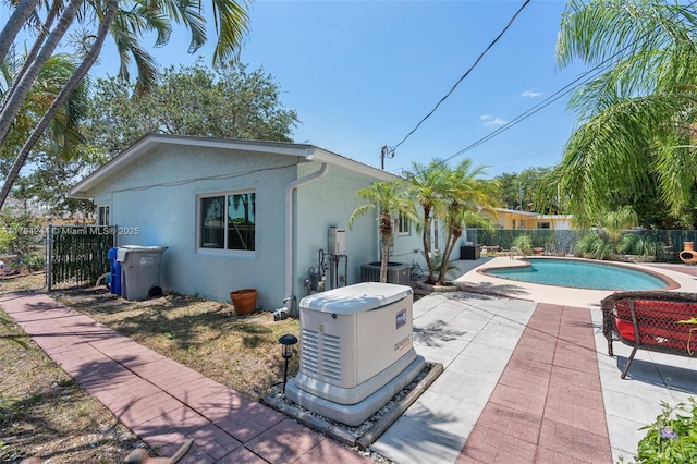 1531 NE 32nd St, Pompano Beach, FL 33064 - view of swimming pool featuring a fenced in pool, cooling unit, fence, and a patio
