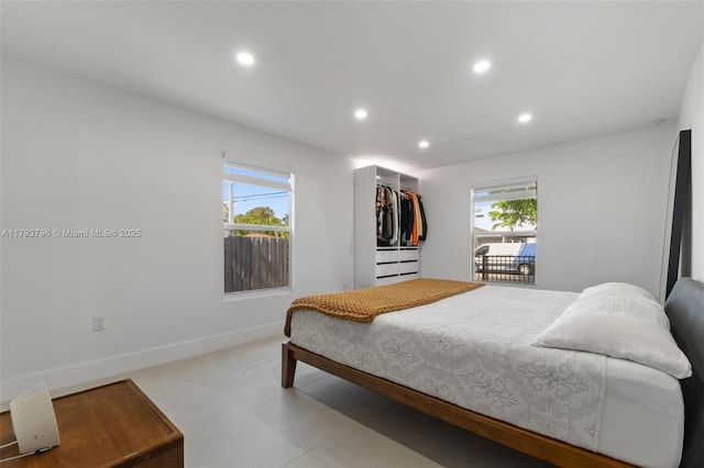bedroom with baseboards and recessed lighting