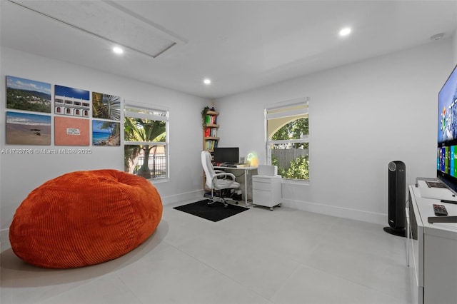office space with a healthy amount of sunlight, baseboards, attic access, and recessed lighting