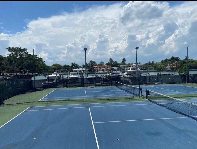 5401 Collins Ave Unit 411, Miami Beach, FL 33140 - view of sport court featuring fence