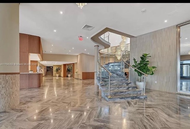 5401 Collins Ave Unit 411, Miami Beach, FL 33140 - building lobby featuring visible vents and stairway