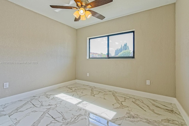 1062 SE 13th Ave, Homestead, FL 33035 - empty room featuring baseboards, ceiling fan, and marble finish floor