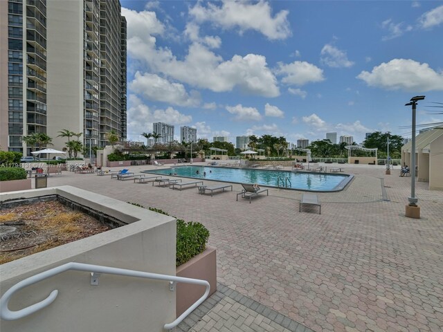 20301 W Country Club Dr Unit 1927, Aventura, FL 33180 - pool featuring a patio area and a view of city