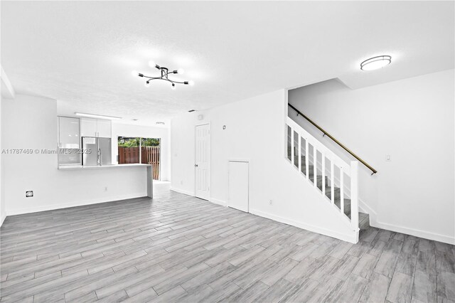 2917 NW Belmont Ln Unit 2917, Cooper City, FL 33026 - spare room featuring baseboards and wood finished floors