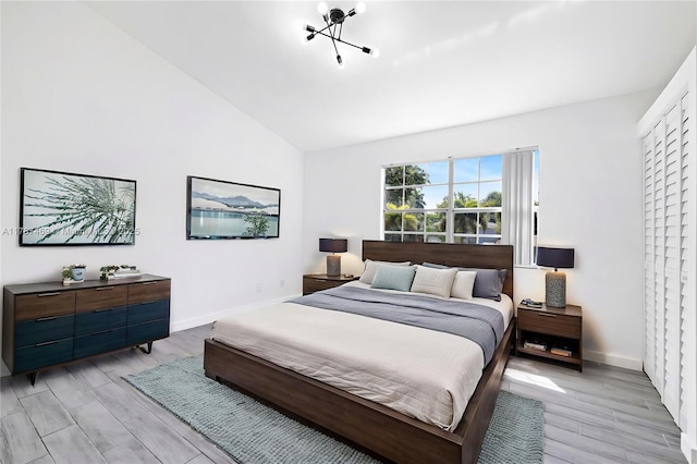 2917 NW Belmont Ln Unit 2917, Cooper City, FL 33026 - bedroom featuring baseboards, vaulted ceiling, and light wood-style flooring