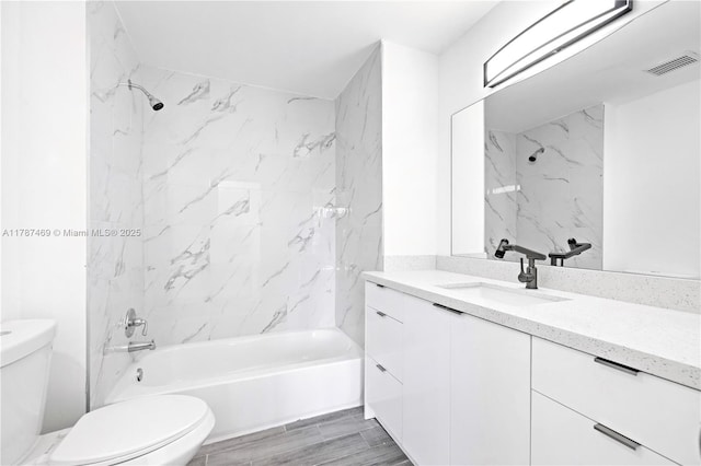 2917 NW Belmont Ln Unit 2917, Cooper City, FL 33026 - full bathroom featuring bathing tub / shower combination, vanity, toilet, and visible vents