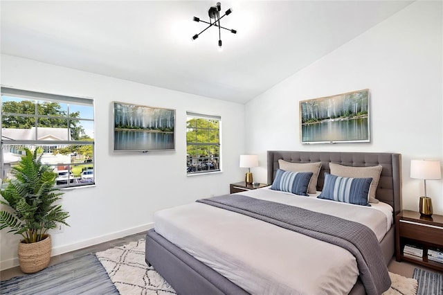 2917 NW Belmont Ln Unit 2917, Cooper City, FL 33026 - bedroom with baseboards, vaulted ceiling, and wood finished floors