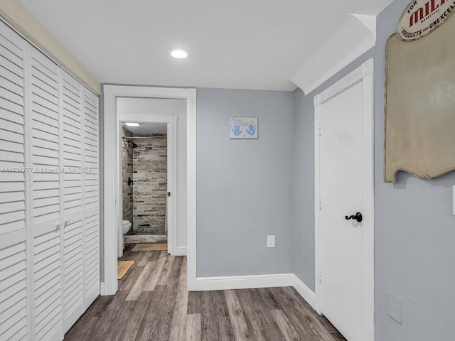 unfurnished bedroom featuring recessed lighting, baseboards, and wood finished floors
