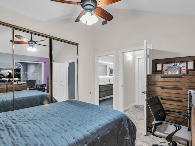 carpeted bedroom with visible vents, ceiling fan, high vaulted ceiling, and ensuite bathroom