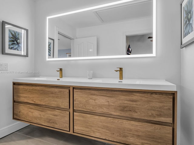 8109 Oakton Ct Unit 9D, Lake Clarke Shores, FL 33406 - bathroom featuring double vanity, tile patterned floors, and baseboards