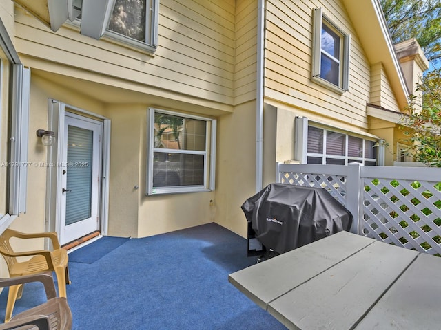 view of patio featuring a grill