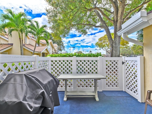 8109 Oakton Ct Unit 9D, Lake Clarke Shores, FL 33406 - view of patio with a grill, a gate, and fence