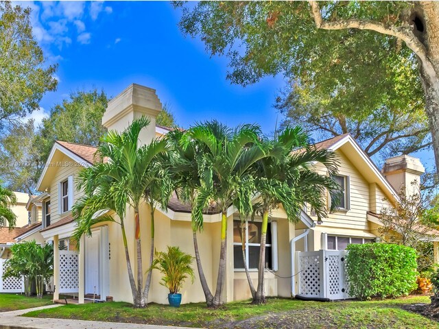 8109 Oakton Ct Unit 9D, Lake Clarke Shores, FL 33406 - view of front of property with a chimney and stucco siding