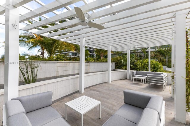 view of patio with a ceiling fan, a pergola, an outdoor living space, and a deck