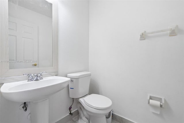 6813 Torch Key St, Lake Worth, FL 33467 - half bath featuring baseboards and toilet