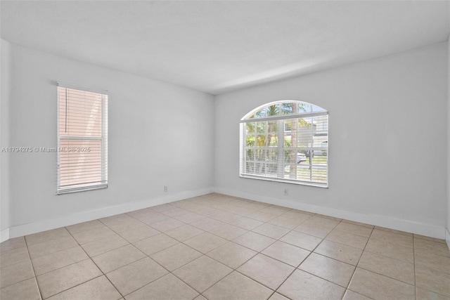 6813 Torch Key St, Lake Worth, FL 33467 - unfurnished room with baseboards and light tile patterned floors