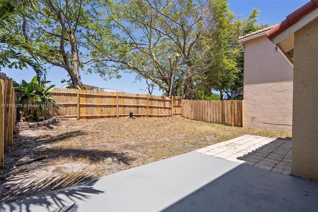 6813 Torch Key St, Lake Worth, FL 33467 - view of yard featuring a fenced backyard and a patio area