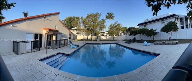 view of swimming pool with a patio, a fenced backyard, and a fenced in pool