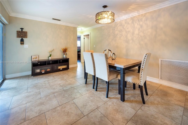 dining space featuring crown molding, visible vents, and baseboards