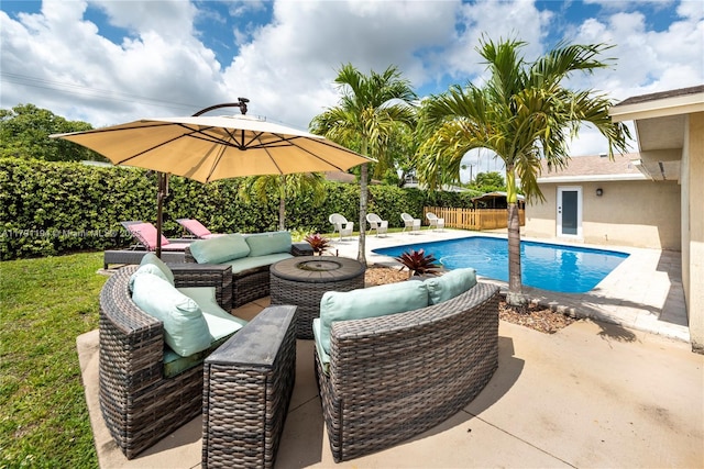 view of pool with a fenced backyard, a patio, outdoor lounge area, and a fenced in pool
