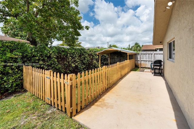 view of patio / terrace featuring fence