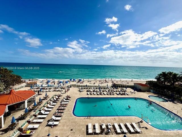community pool featuring a water view