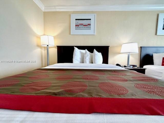 bedroom featuring ornamental molding