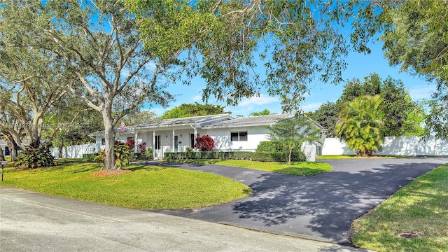8195 SW 151st St, Palmetto Bay, FL 33158 - single story home with fence, covered porch, a front yard, stucco siding, and driveway