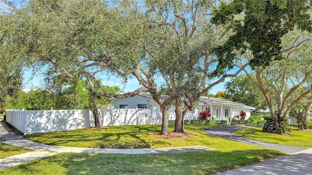 8195 SW 151st St, Palmetto Bay, FL 33158 - view of front of house featuring a front lawn and fence