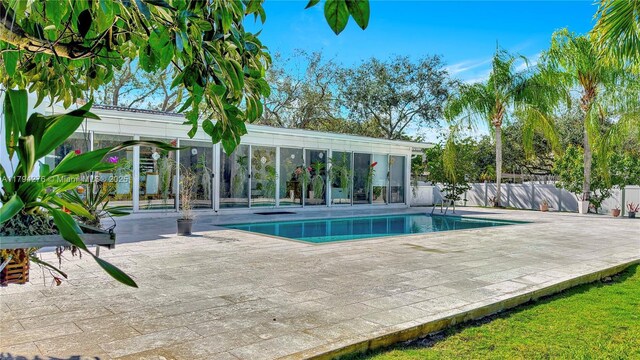 8195 SW 151st St, Palmetto Bay, FL 33158 - view of pool with fence, a fenced in pool, and a patio area